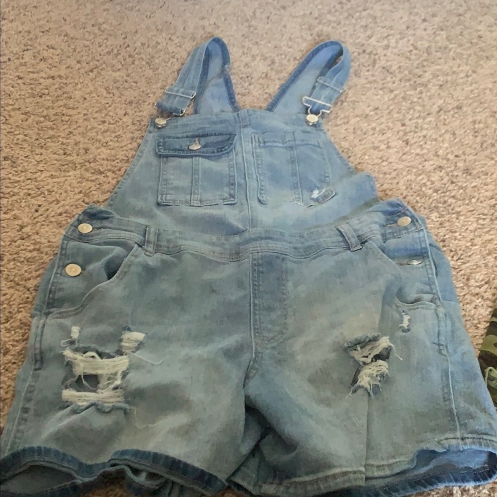 Two pains of barely worn overalls for women.